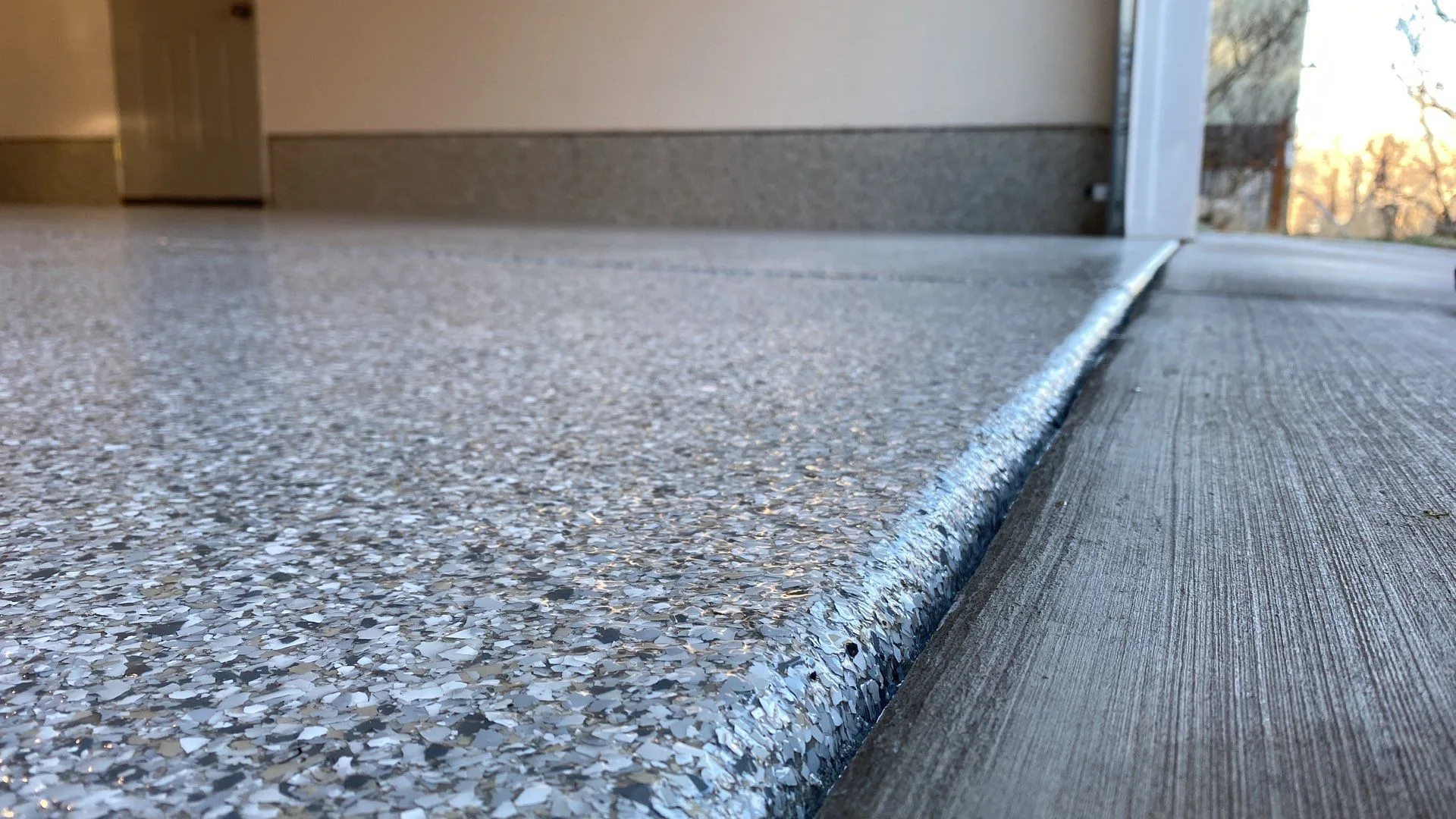Finished polyurea garage floor coating in a residential garage