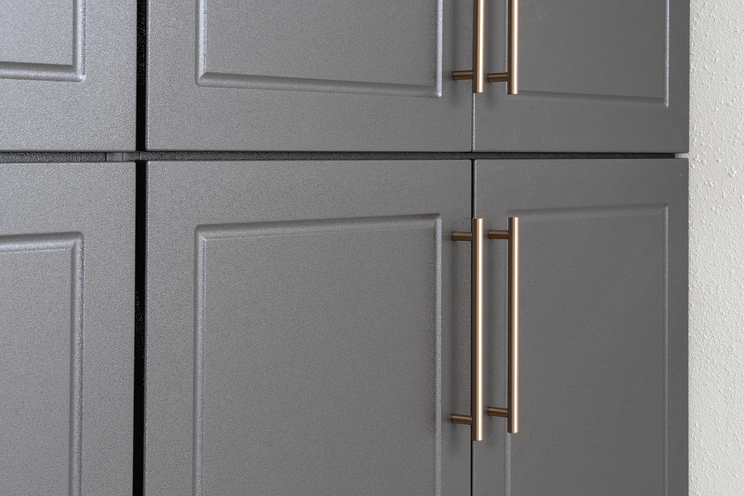 Blue powder-coated garage cabinet installation