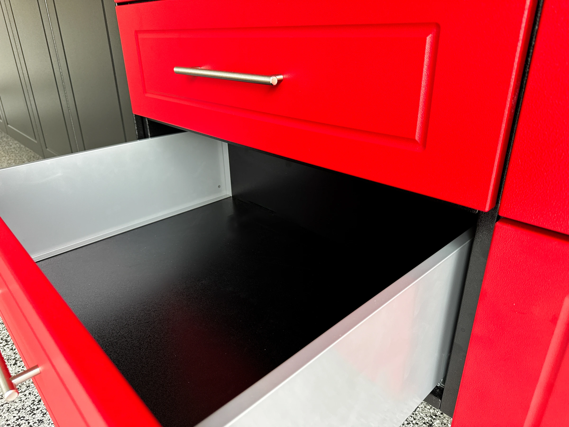 Black and red garage cabinet installation