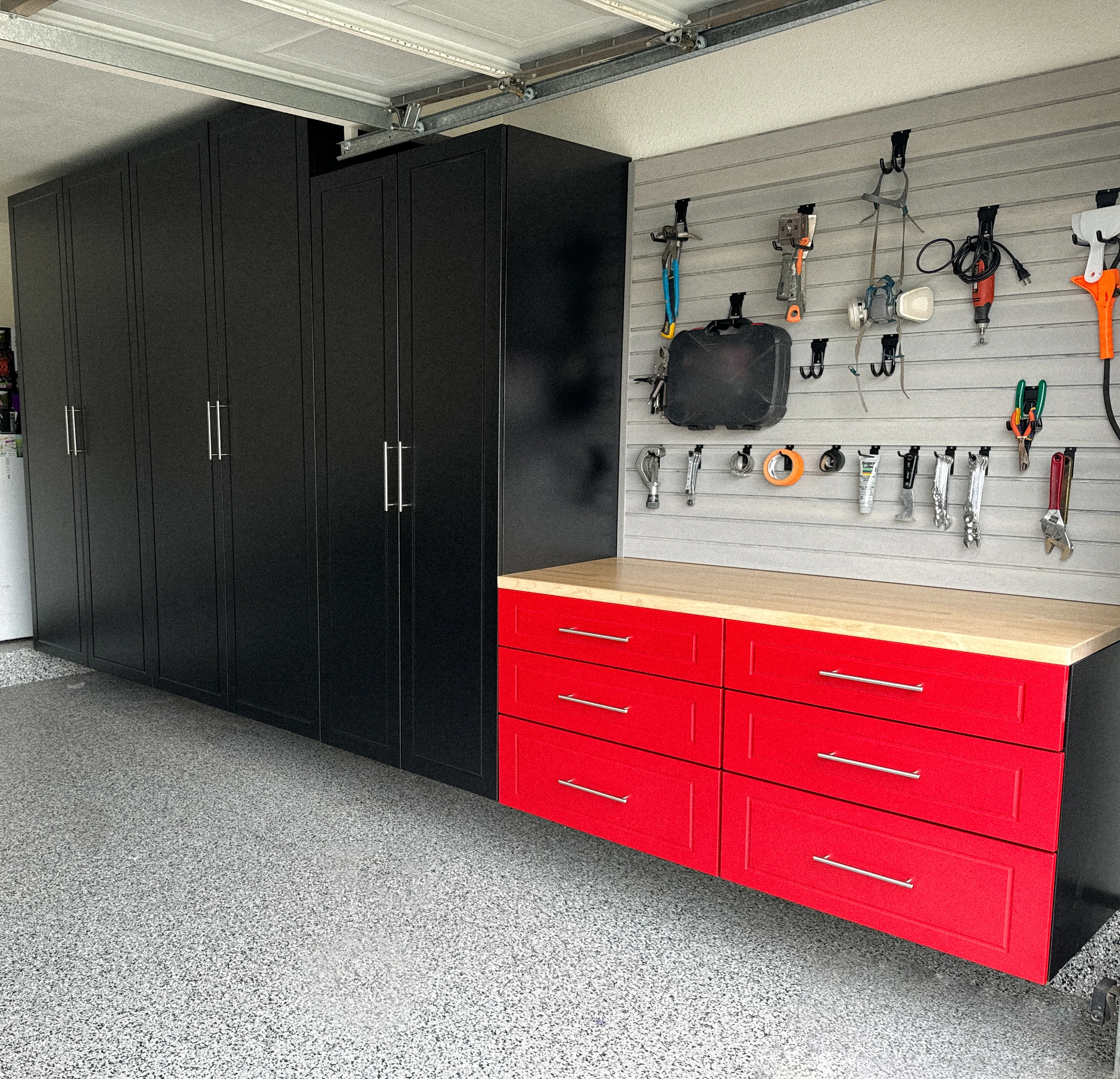 Black and red garage cabinet installation