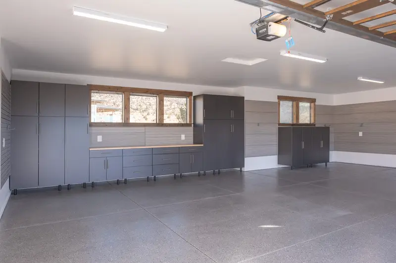 Full garage cabinet installation with overhead storage